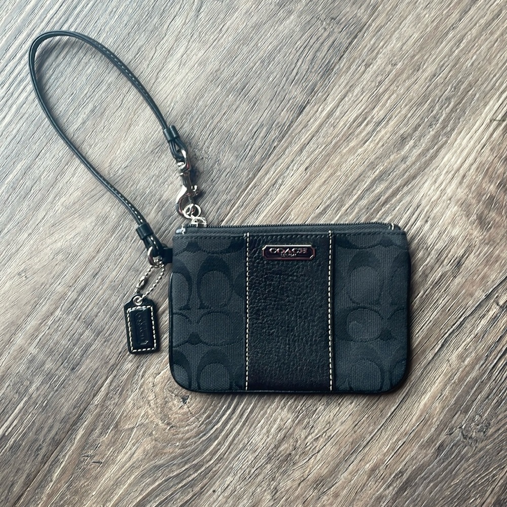 Coach wristlet - black with classic logo and purple interior.